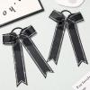imageDEEKA Long Tail Rhinestones Cheer Bows 12 PCS Collegiate Style Cheer Bows Full Rhinestone Skinny Cheer Bow Ponytail Holder Handmade Bows for Girls Teens Cheerleader Sports WhiteBlack