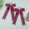 imageDEEKA 12 PCS Collegiate Style Cheer Bows Long Tail Skinny Ponytail Holder Handmade for Girls Teens Softball Cheerleader Sports RedMaroon